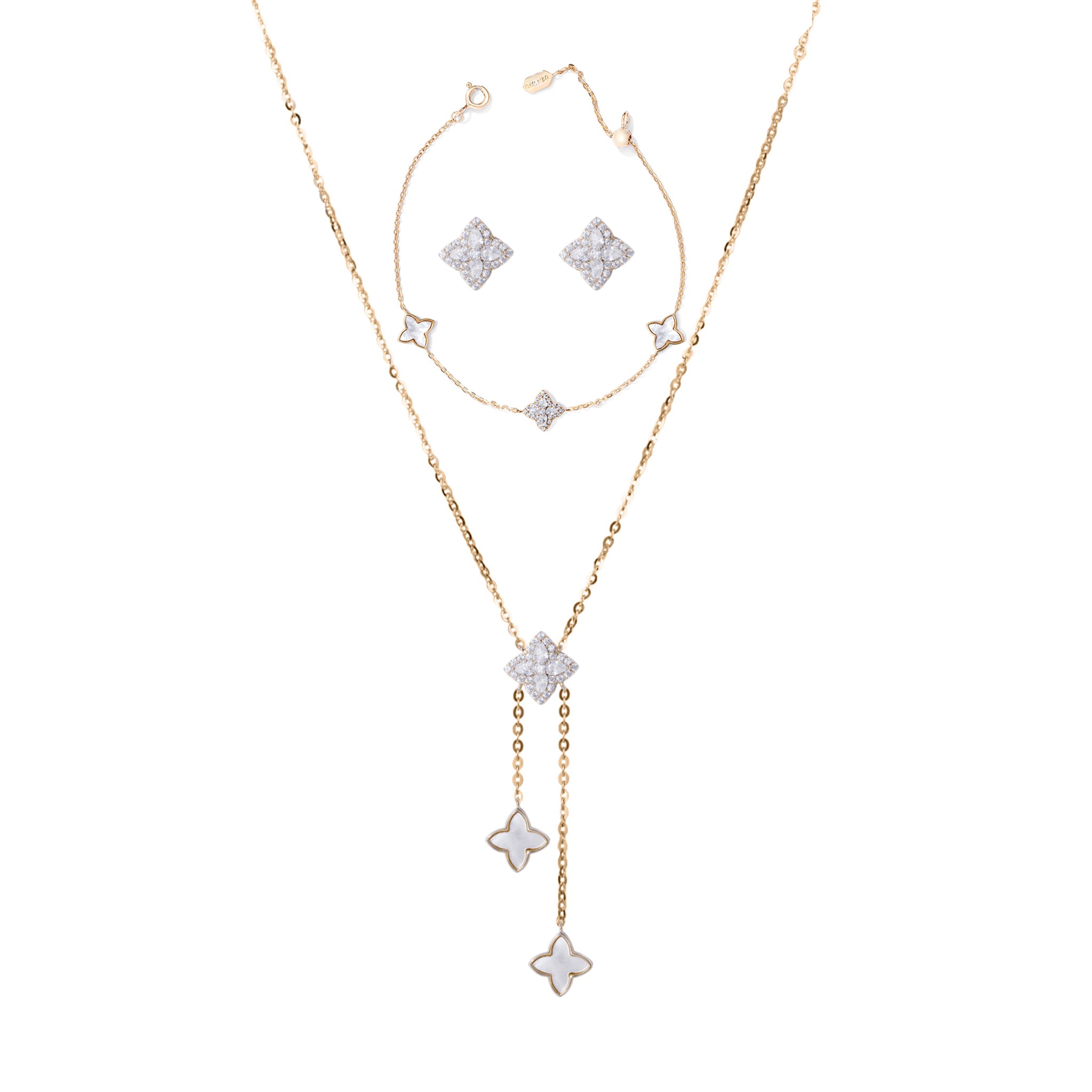 A sterling silver jewelry set including a necklace, earrings, and bracelet with gold accents and silver stars.