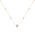 A necklace with a gold-plated chain and a rectangular pendant featuring a combination of zircon stones and a mother pearl stone.