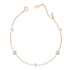 A bracelet with gold and silver colors, featuring faux pearls and zircon stones on a chain link design.