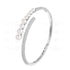 Silver bracelet with pearls and small stones on a white background