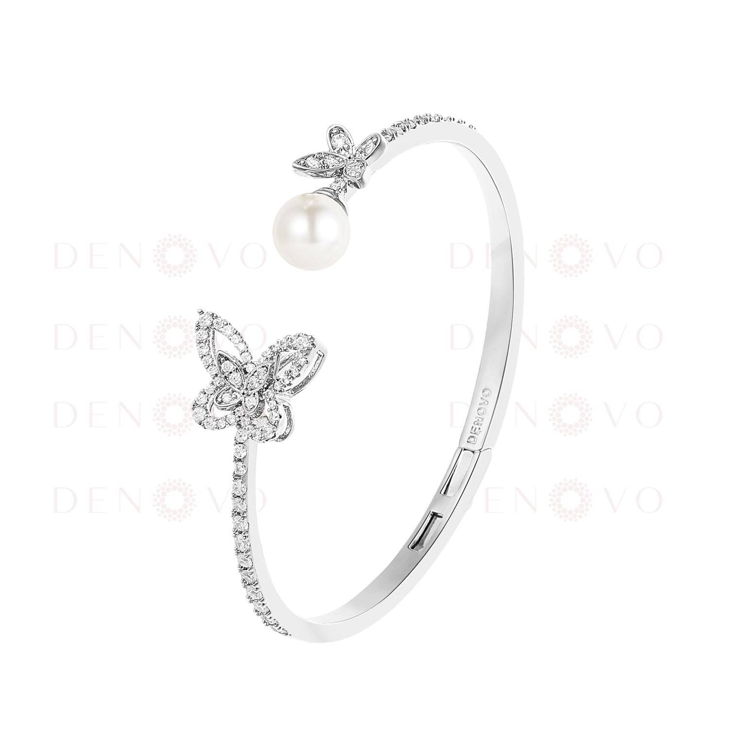 A person's wrist wearing a gold-plated bangle bracelet adorned with zircon stones and a pearl charm.