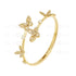 A gold-colored bangle bracelet with butterfly patterns and zircon stones
