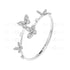 A gold-colored bangle bracelet with butterfly patterns and zircon stones