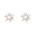 A pair of gold-plated firework pearl earrings with a sunburst design.