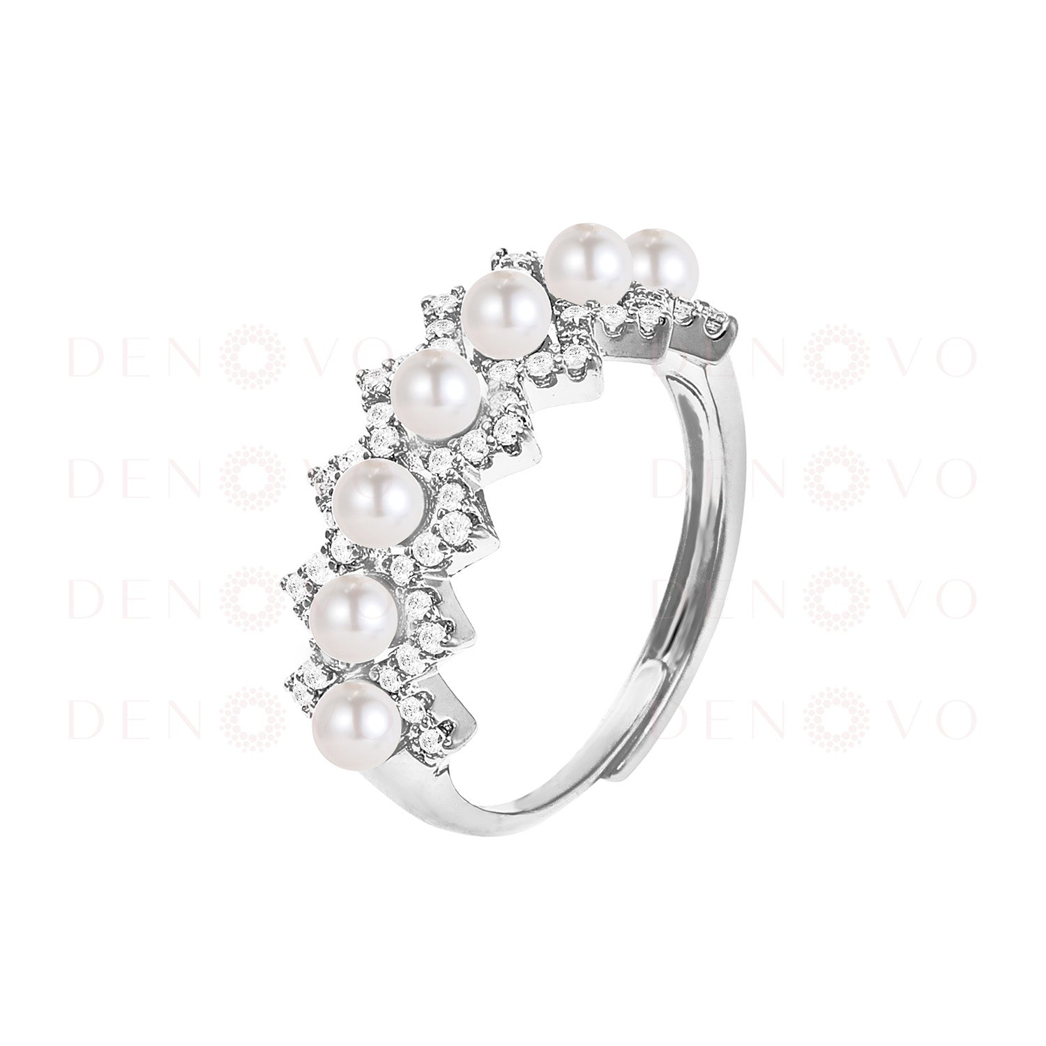 Silver ring with pearls and small stones on a white background